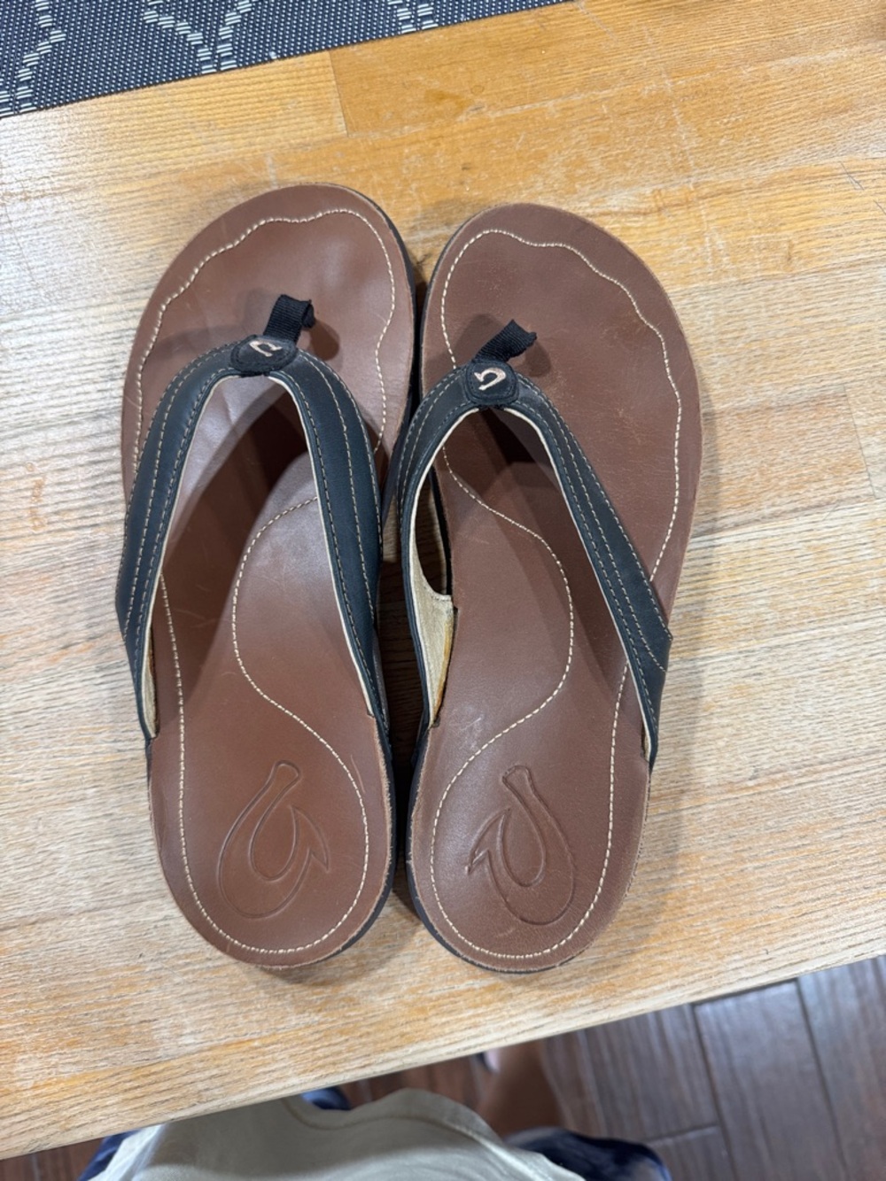 OluKai Brown and Black Leather Flip Flops